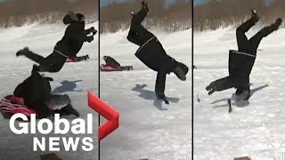 Reporter flipped by sled during news report OFFICIAL VIDEO [upl. by Yedorb254]